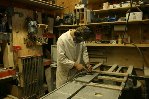 Greg Seuren sanding a soapstone sink part